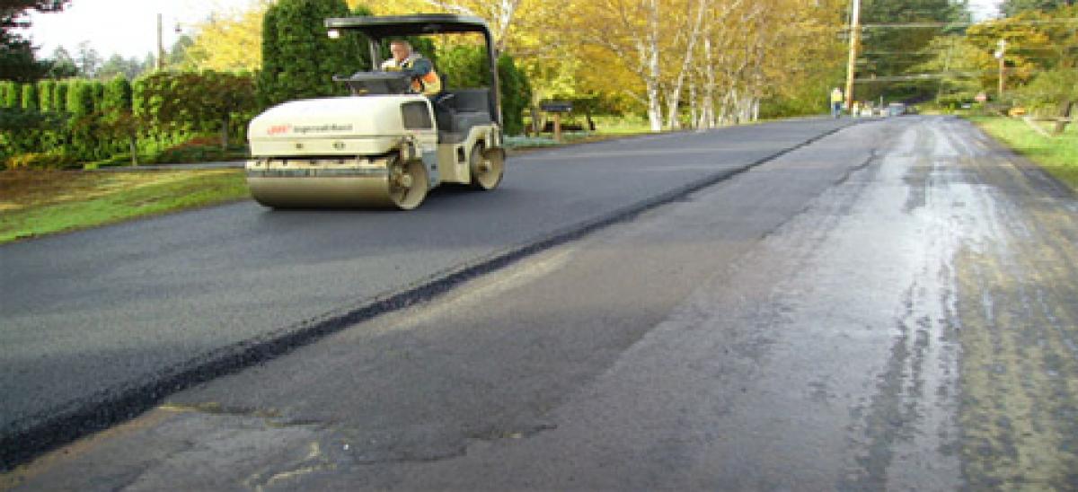 Man repaving a road
