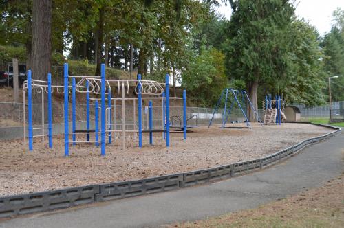 Playground with concrete walking path