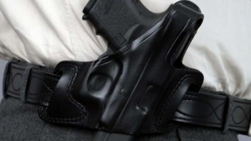 Pistol in Holster on Belt