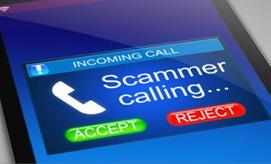 Cell phone displaying a warning that a scammer is calling