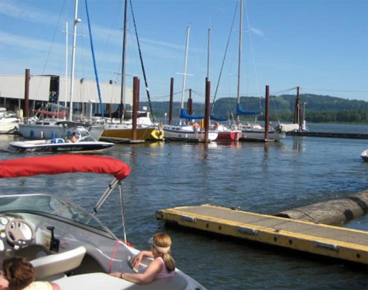People in their boats at a dock